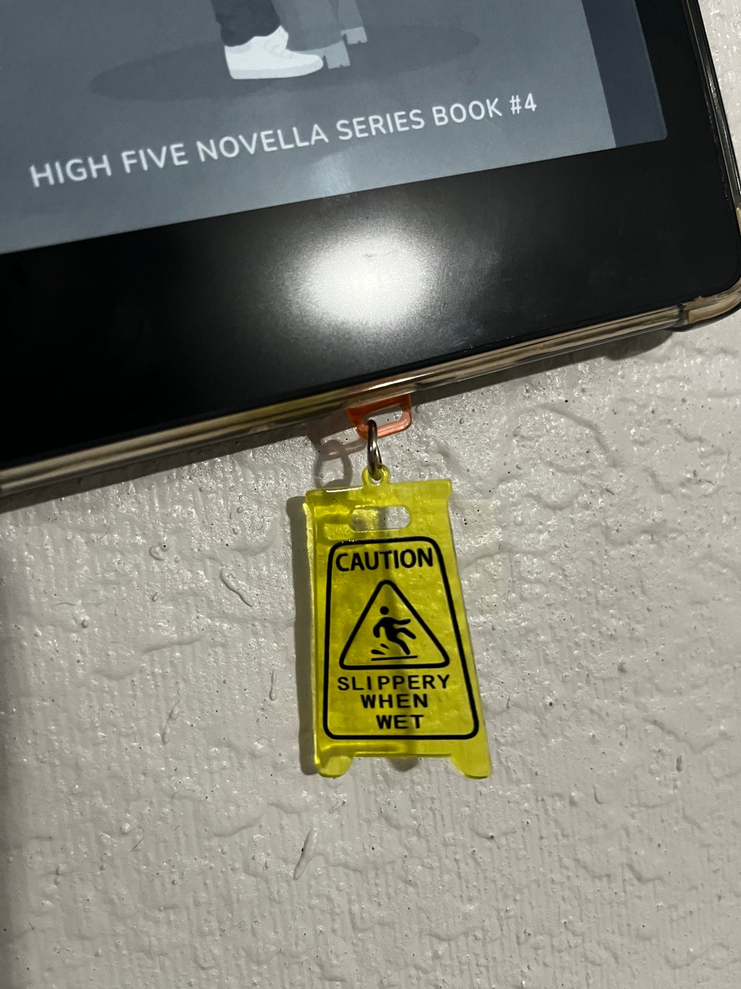 Caution Slippery Dust Plug Charm